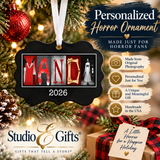 The image is a promotional advertisement for Studio & Gifts, featuring a personalized horror ornament with the word "MANDI" made from photography. The ornament is hanging from a string, and there is a Christmas tree in the background. The ad highlights the ornament's unique design and the fact that it is handmade in the USA.