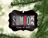 A black ornament hanging from a tree branch with the word "SENIOR" spelled out in a decorative font.