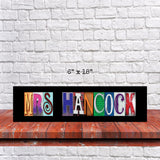 May include: A black framed sign with in colorful, mismatched letters. The letters are made of different materials and have a vintage look. The sign is 6 inches by 18 inches.