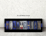 The image is a metal print featuring the word "MICHIGAN" in a creative and artistic way, with various objects and symbols arranged to spell out the letters.