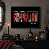 a dark and spooky room with a framed poster of the word "SHADICK" hanging on the wall, along with a few other items such as candles, a skull, and a framed sign.