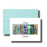 A greeting card with the word "SWEET 16" made up of colorful letters, placed on top of a light blue envelope.
