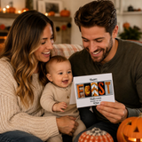 A happy family of three - a mother, father, and baby - sitting together and smiling. The baby is holding a card with the word "FORST" written on it.