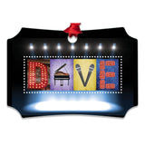 A sign with the word "DIVE" spelled out using colorful letters, with a stage and musical instruments displayed in the background.