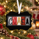 Red wrestling coach personalized Christmas ornament with white ribbon hanging on a Christmas tree