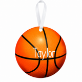 Personalized basketball metal ornament with white Taylor name and white ribbon on white background