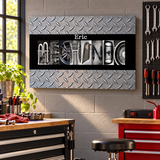 Original Eric MECHANIC photographic letter art with diamond-plate background displayed in a workshop