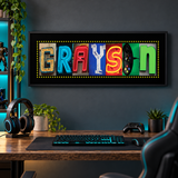 Personalized GRAYSON retro gamer photographic letter art with black matte above a gaming desk
