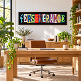 Original colorful PERSEVERANCE photographic letter art displayed in a bright home office
