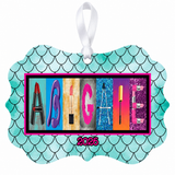 Abigail makeup letter art ornament with white ribbon and 2026 date