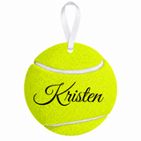 Personalized Kristen tennis ball metal ornament with white ribbon on white background
