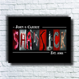 A framed artwork featuring the word "SHADICK" made up of various images, including a skull, a skeleton, and other dark-themed elements.