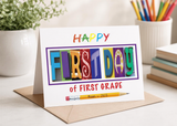 A colorful greeting card with the text "Happy First Day of First Grade" displayed prominently.
