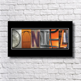 A framed collage of various images arranged to spell out the word "NOLA", which stands for New Orleans.